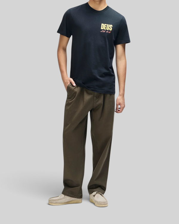 Baffle Haus black box fit organic cotton t-shirt with chest graphic print worn by a model with olive trousers
