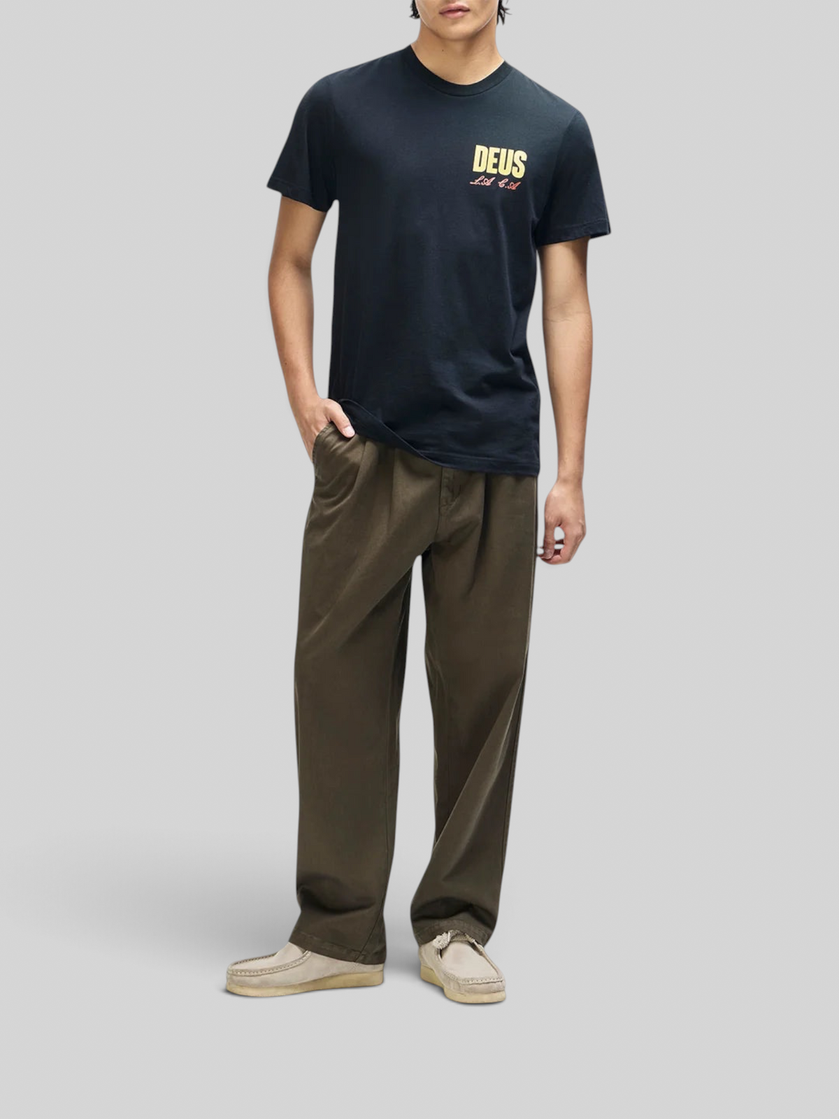 Baffle Haus black box fit organic cotton t-shirt with chest graphic print worn by a model with olive trousers