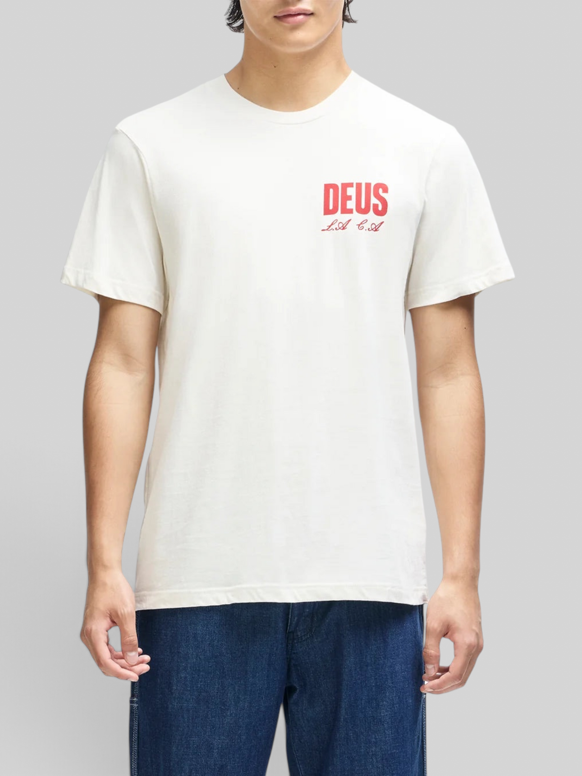 Baffle Haus vintage white box fit organic cotton tee with red chest graphic print worn by a model