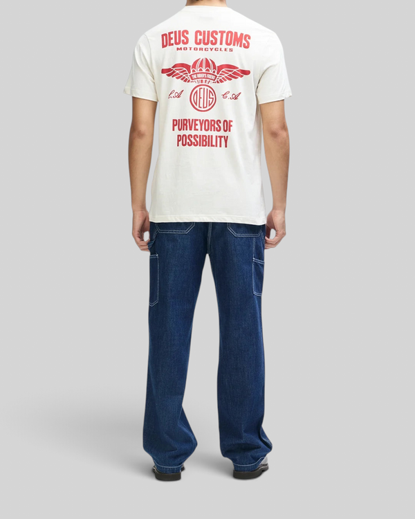 Baffle Haus vintage white organic cotton box fit tee with red motorcycle graphic print on back worn by a man
