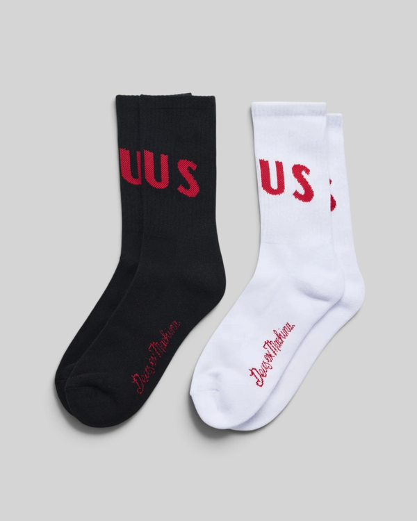 Baffle Haus Ranger crew socks in a 2-pack featuring one black and one white pair with red jacquard knit branding.