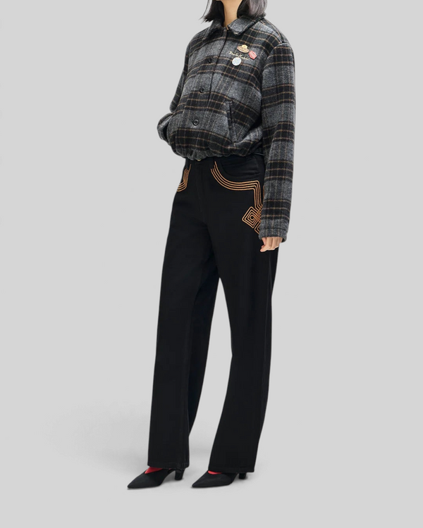 Baffle Haus Lost World wool blend bomber jacket in phantom grey check with custom pins worn by a model