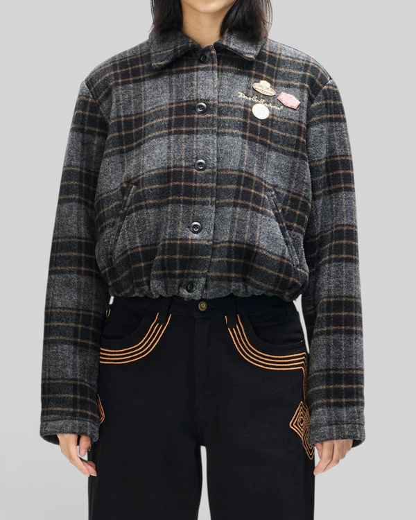 Baffle Haus Lost World bomber jacket in phantom grey check wool blend with custom pins and a cinched drawstring hem.