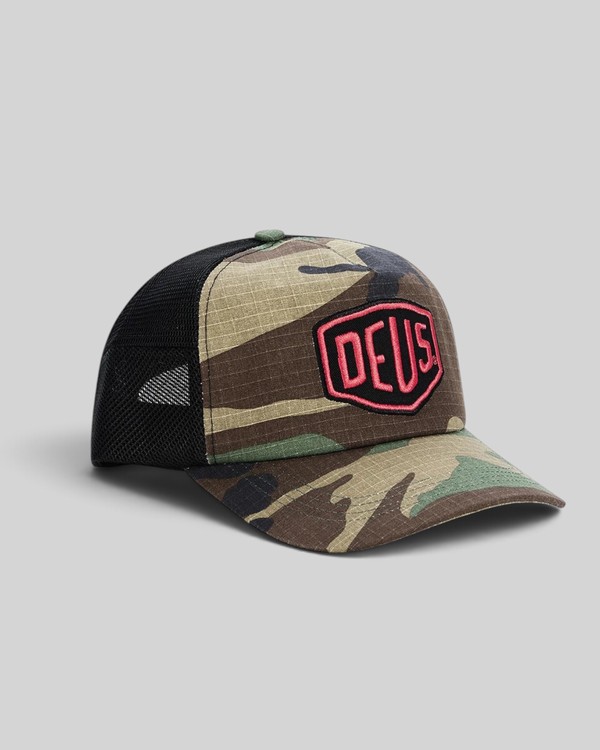 Baffle Haus Paris Shield trucker cap in camo cotton ripstop with black mesh back and red Deus Ex Machina patch