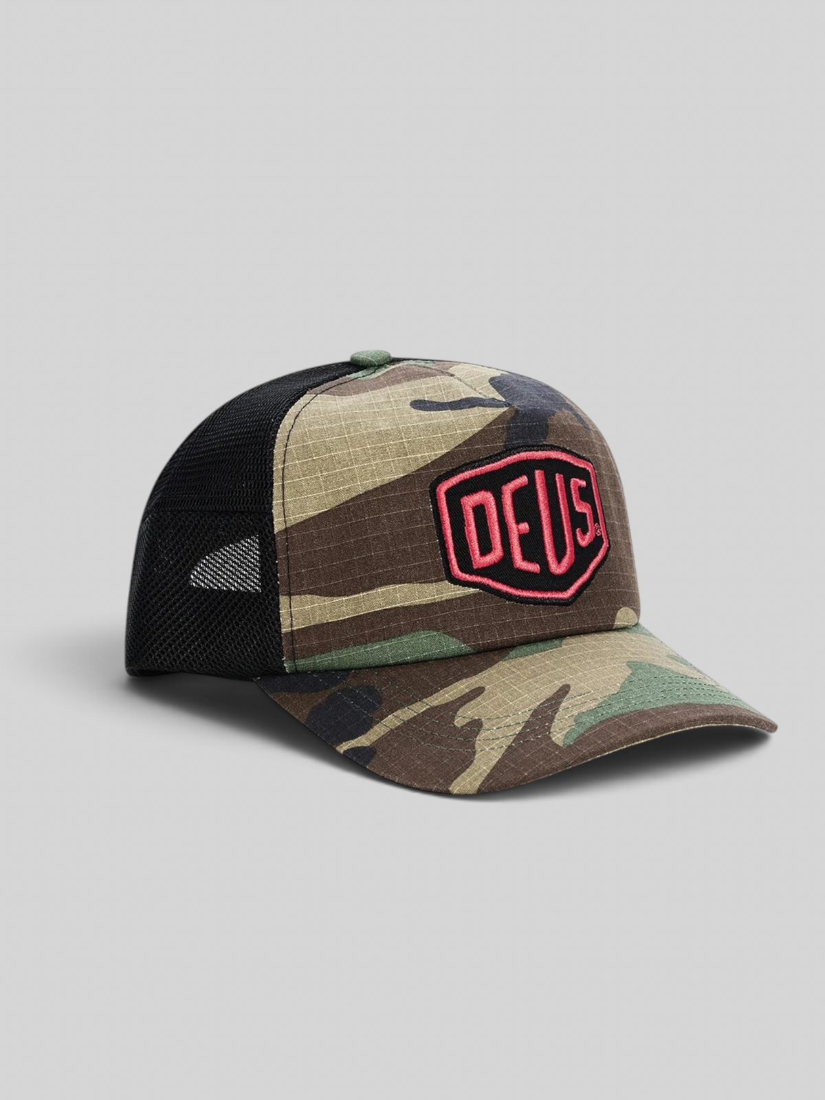 Baffle Haus Paris Shield trucker cap in camo cotton ripstop with black mesh back and red Deus Ex Machina patch