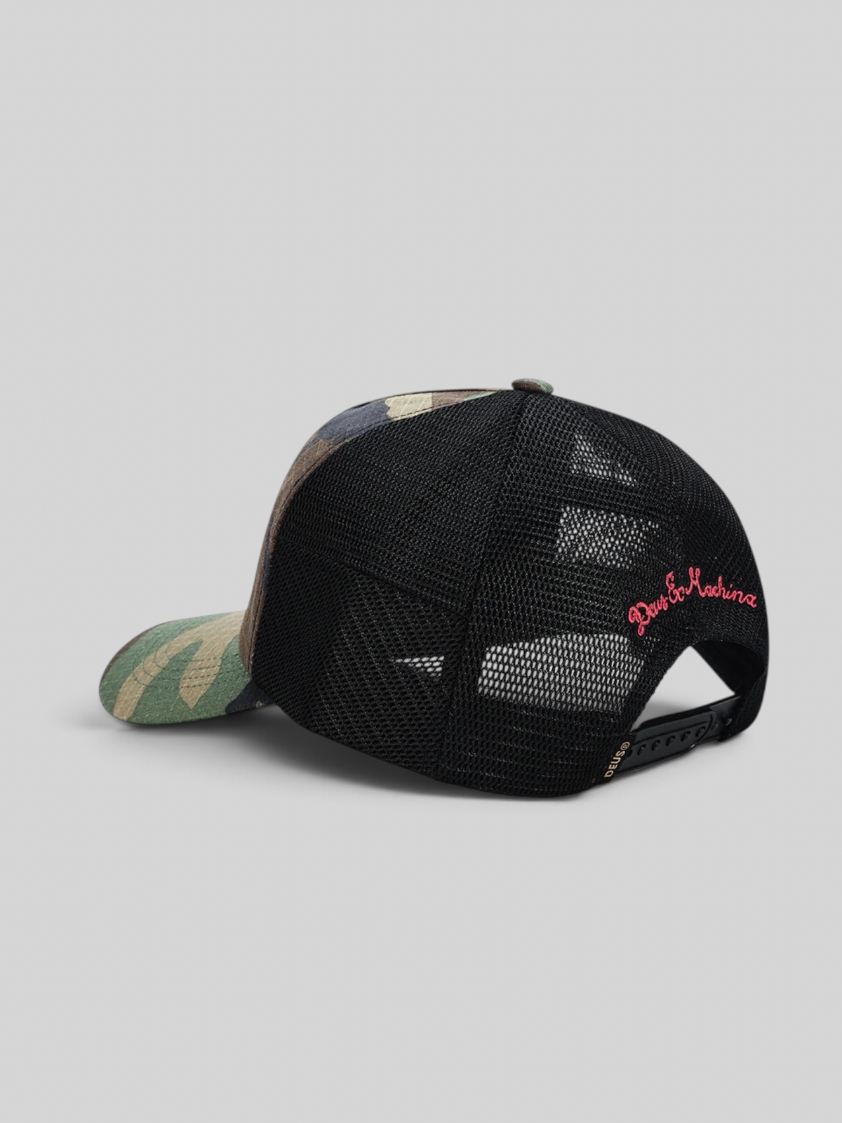 Baffle Haus Paris Shield trucker cap in camo print with black mesh back, snapback closure, and red embroidery detail.