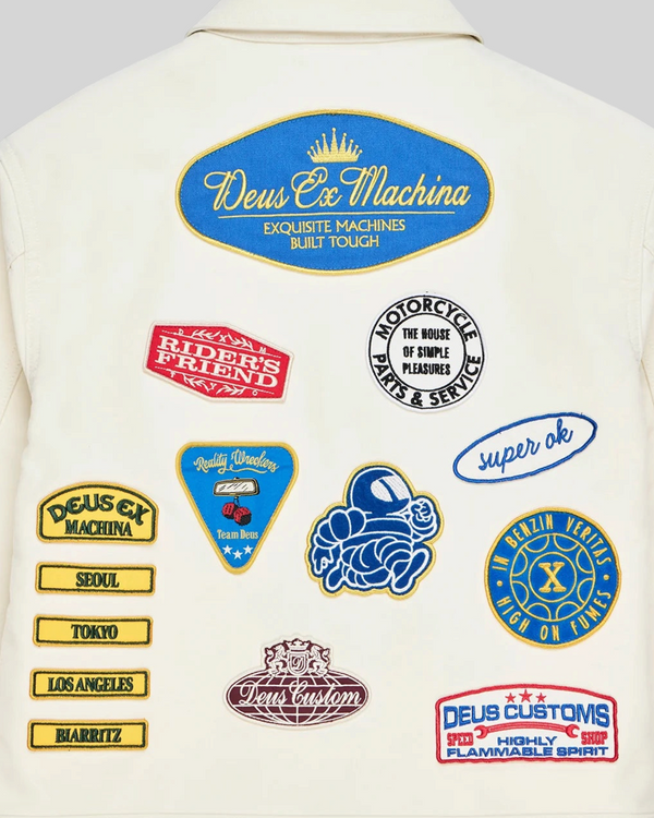 Baffle Haus Trophy Jacket in whisper white cotton moleskin featuring various colourful embroidered graphic patches