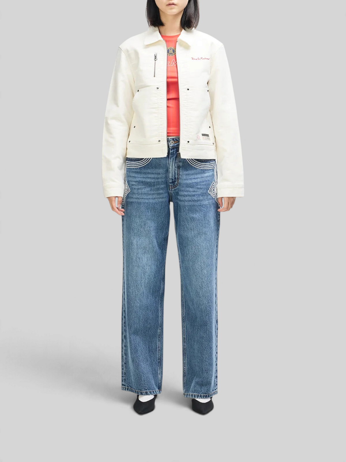 Baffle Haus Trophy Jacket in whisper white cotton moleskin with front patch pockets and rivet detailing on a model