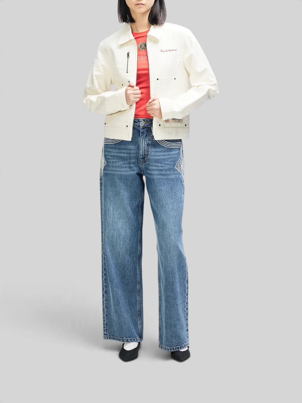 Baffle Haus Trophy Jacket in whisper white cotton moleskin with patch pockets and woven labels, worn by a model