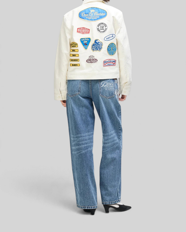 Baffle Haus Trophy Jacket in whisper white cotton moleskin featuring colorful vintage-style patches on the back