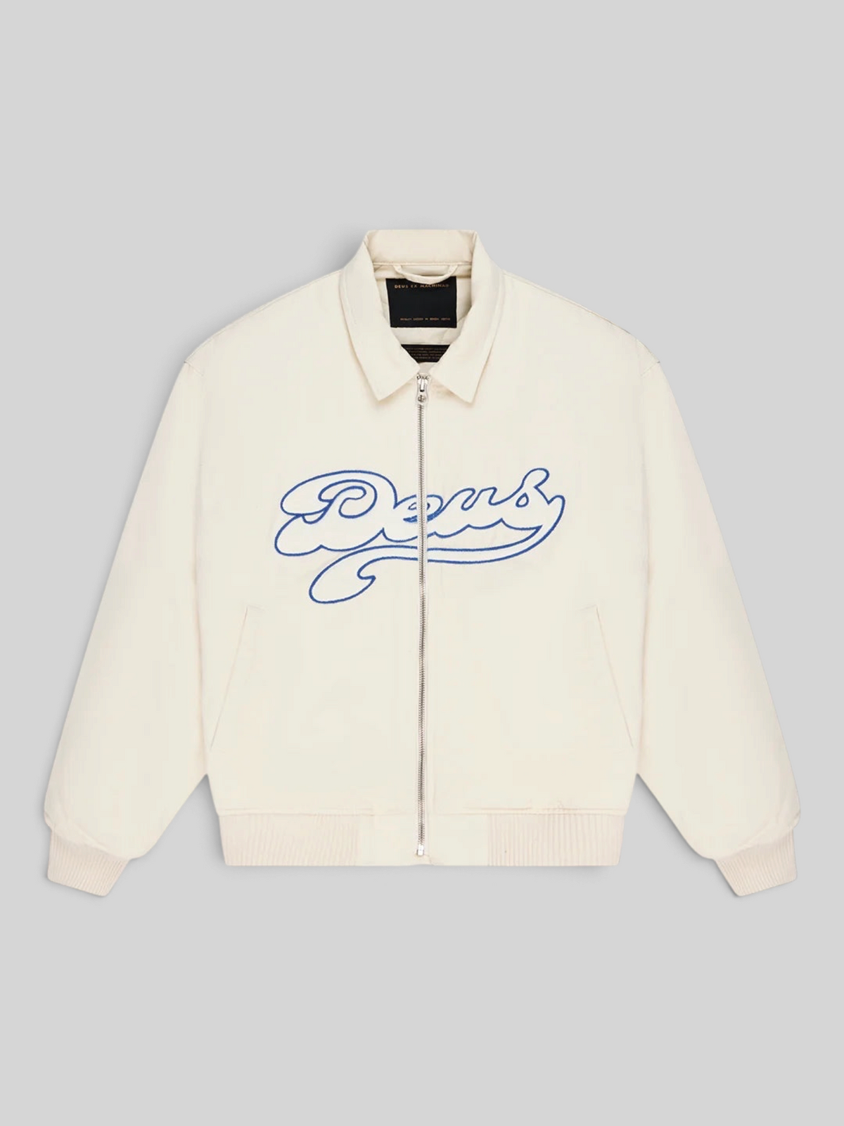 Baffle Haus Runner-Up jacket in whisper white cotton twill with blue velvet Deus applique and zip front closure.