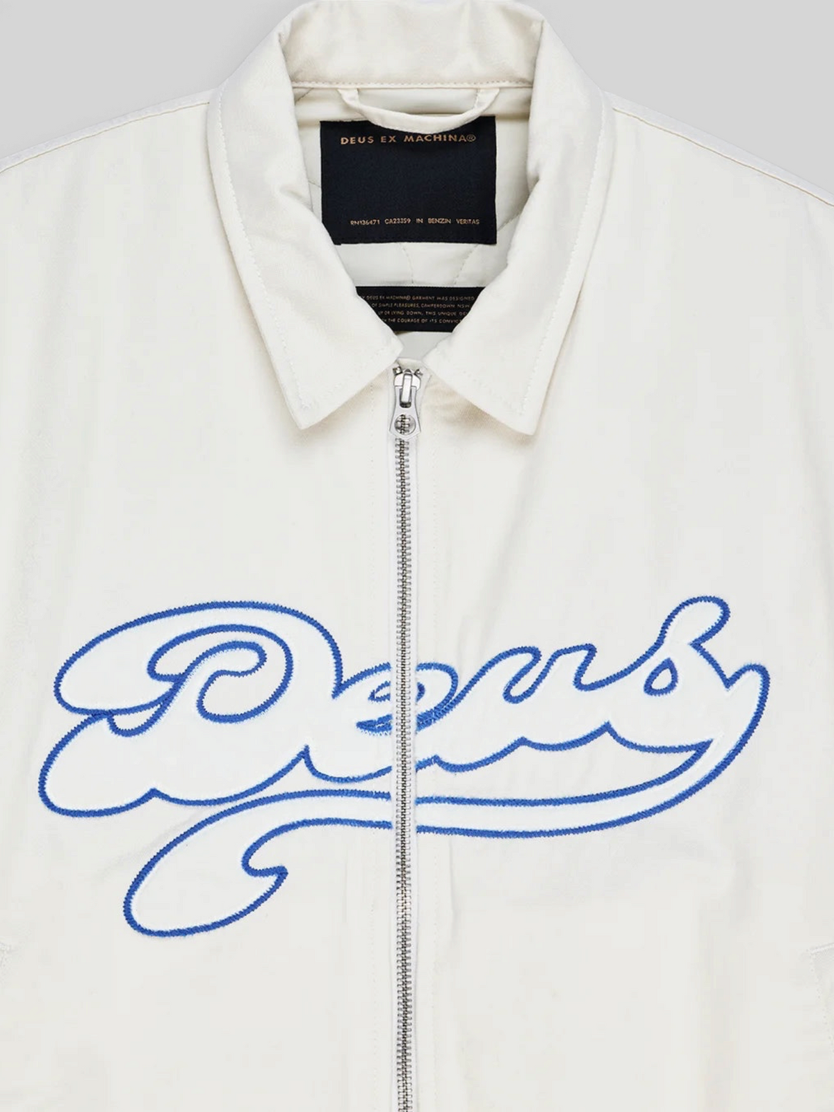 Baffle Haus Runner-Up jacket in whisper white cotton twill with blue Deus velvet applique and silver zip front