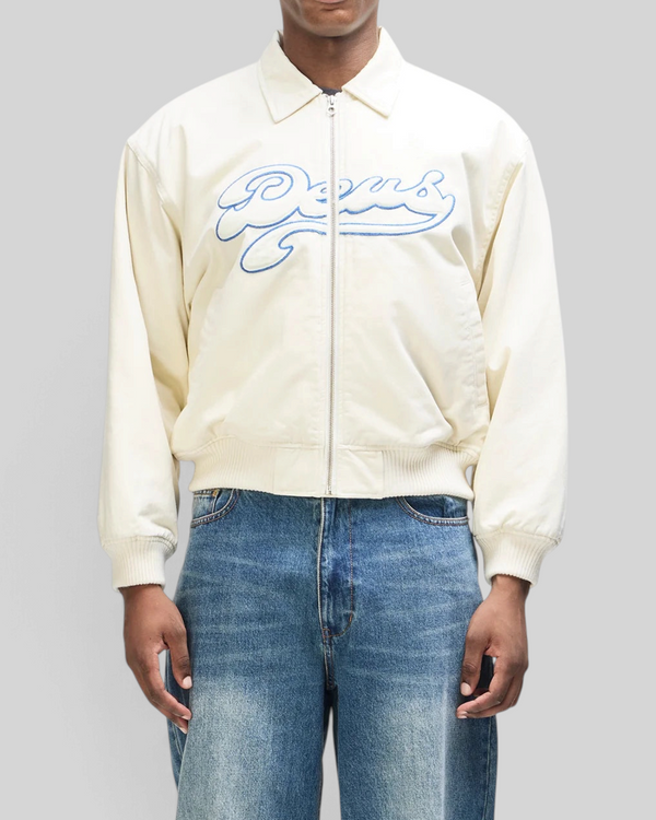 Baffle Haus Runner-Up jacket in whisper white cotton twill with blue Deus velvet applique and ribbed cuffs
