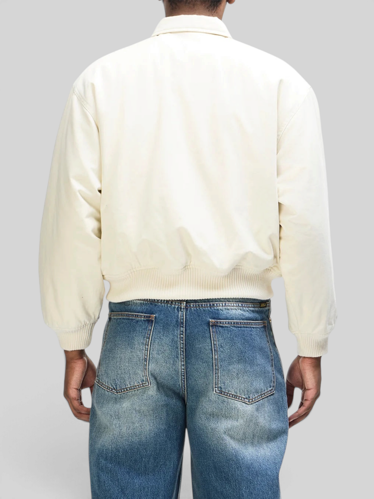 Back view of Baffle Haus Runner-Up Jacket in whisper white cotton twill with ribbed hem and cuffs
