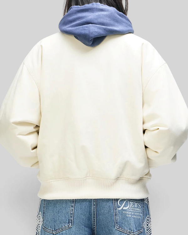 Baffle Haus Runner-Up jacket in whisper white cotton twill with rib cuffs and hem, shown from the back.
