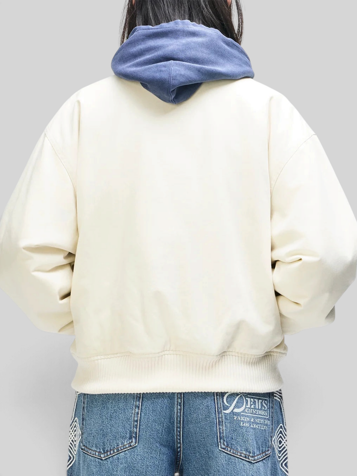 Baffle Haus Runner-Up jacket in whisper white cotton twill with rib cuffs and hem, shown from the back.