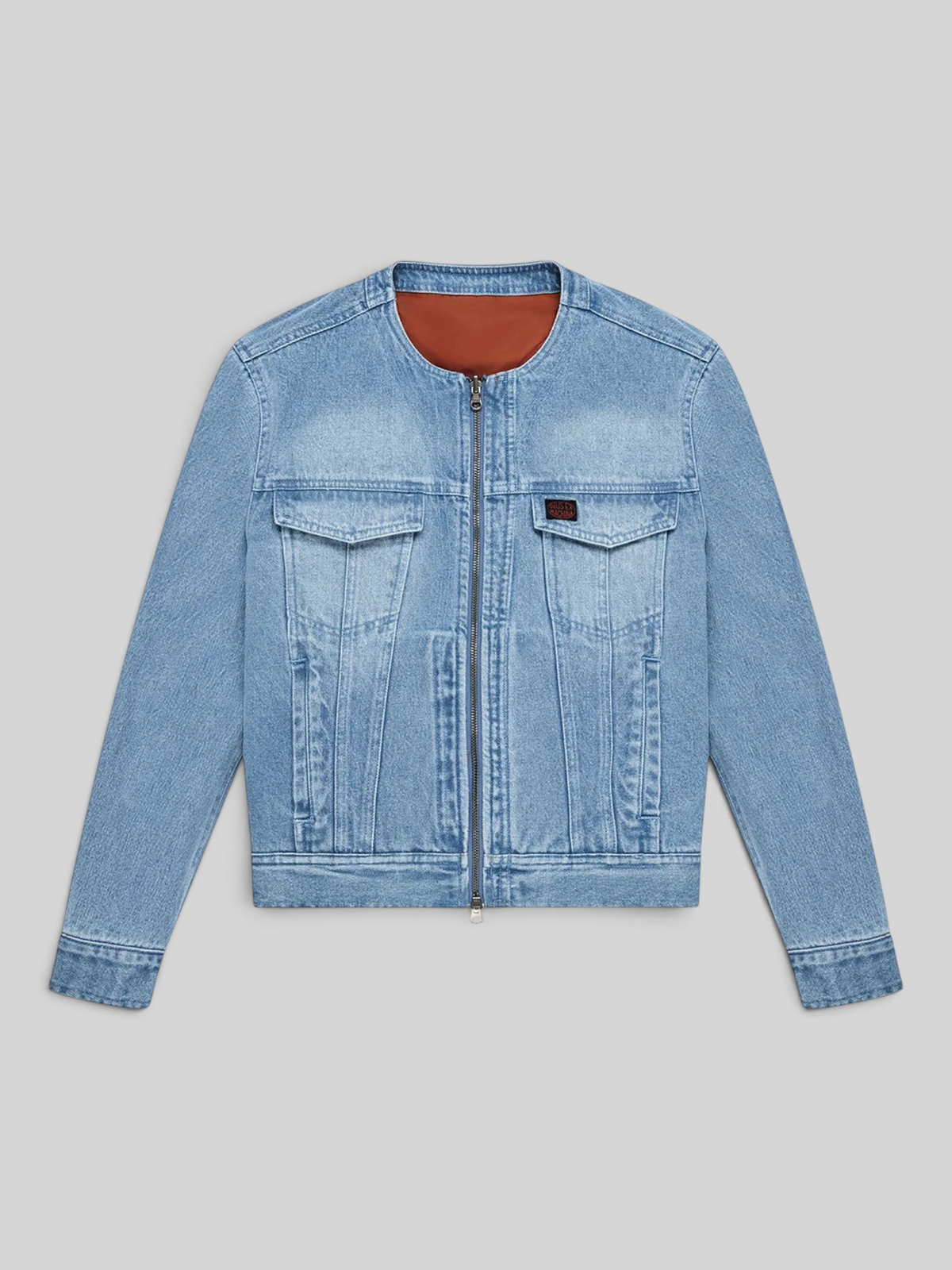 Baffle Haus Br 163 reversible denim jacket in light blue with a rust-coloured nylon interior and double zip closure.