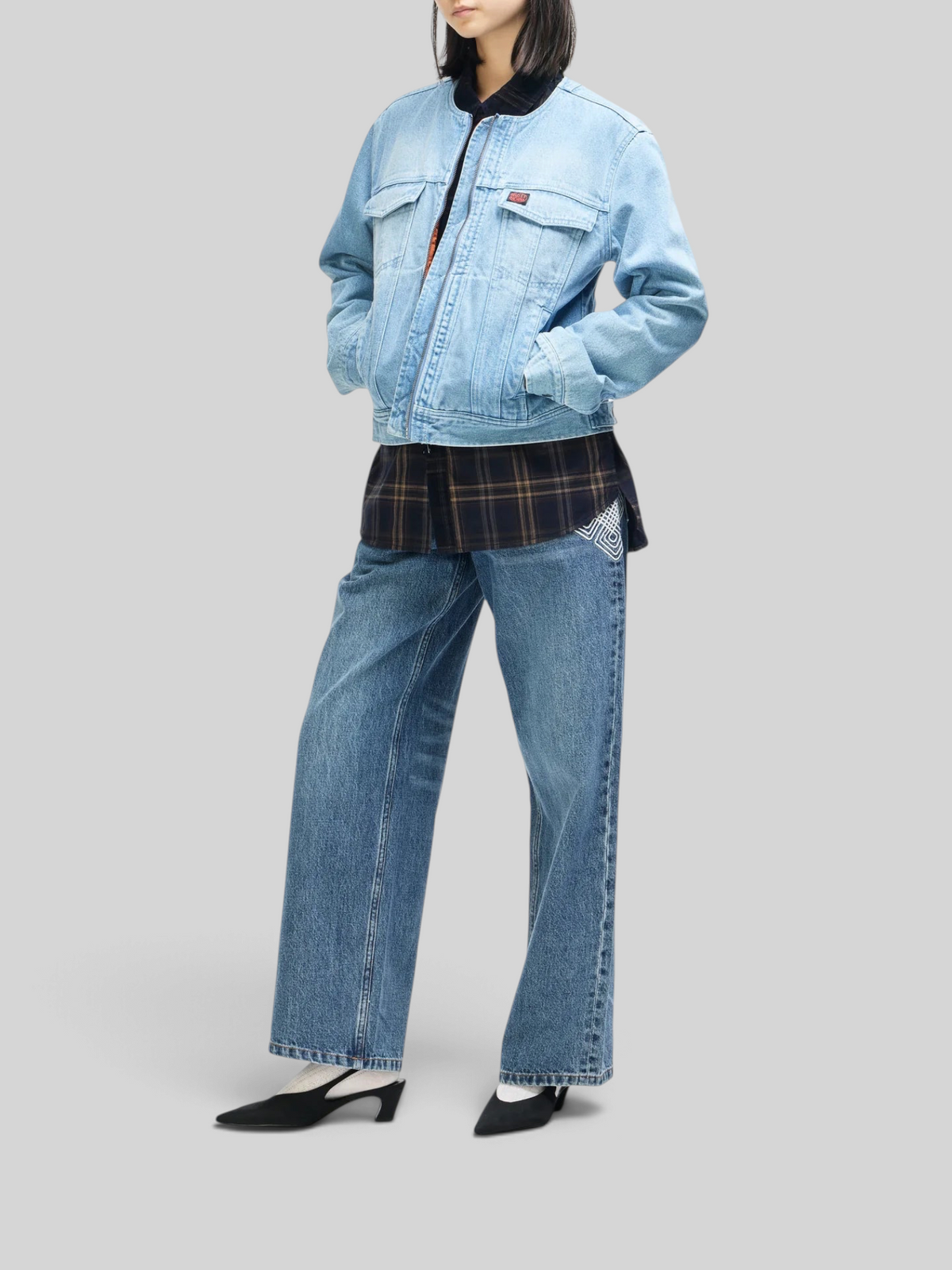 Baffle Haus Br 163 reversible denim jacket in light indigo worn over a plaid shirt and wide-leg jeans