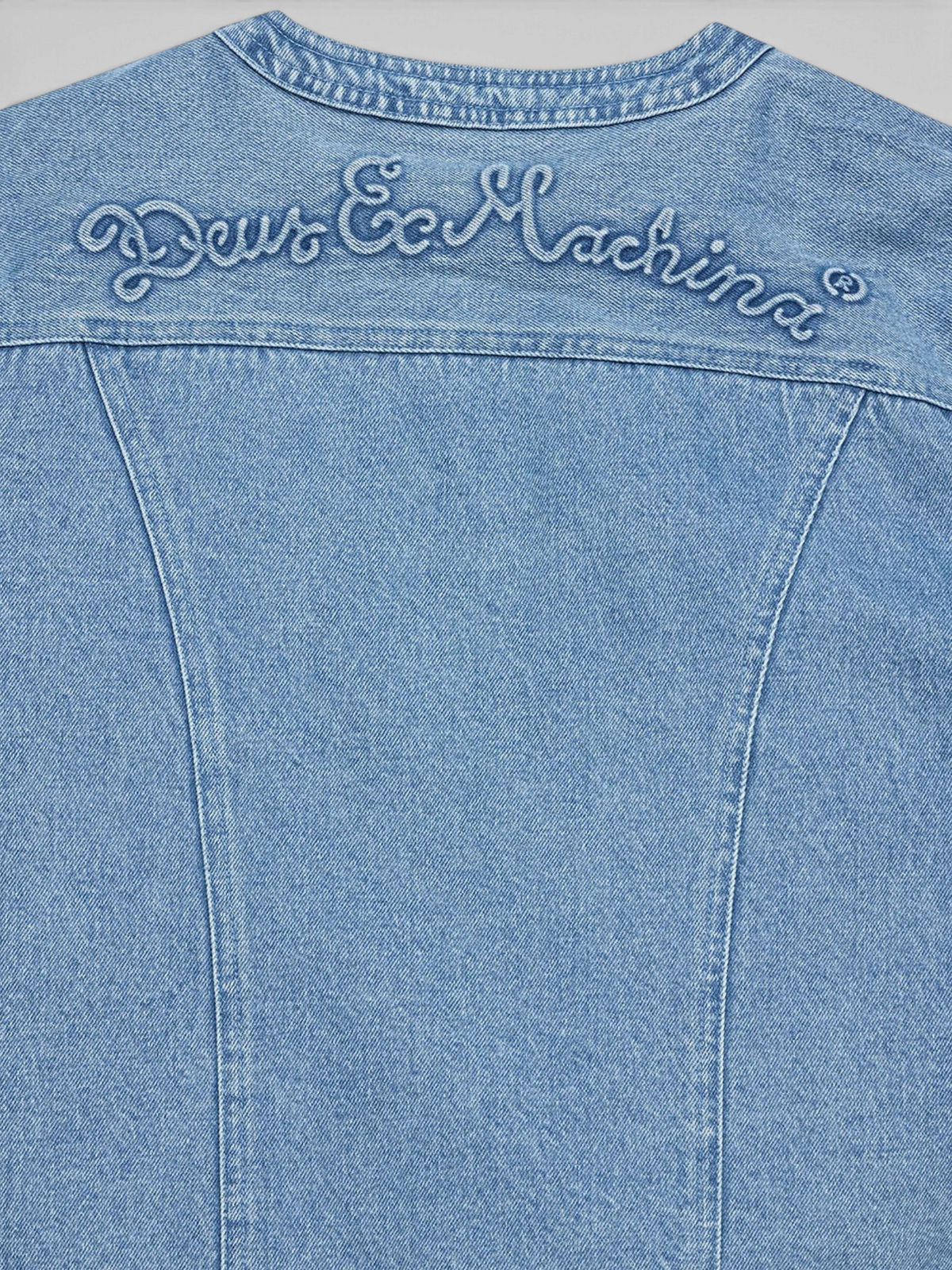 Baffle Haus Br 163 reversible denim jacket back yoke with embossed Deus Ex Machina logo in light indigo blue