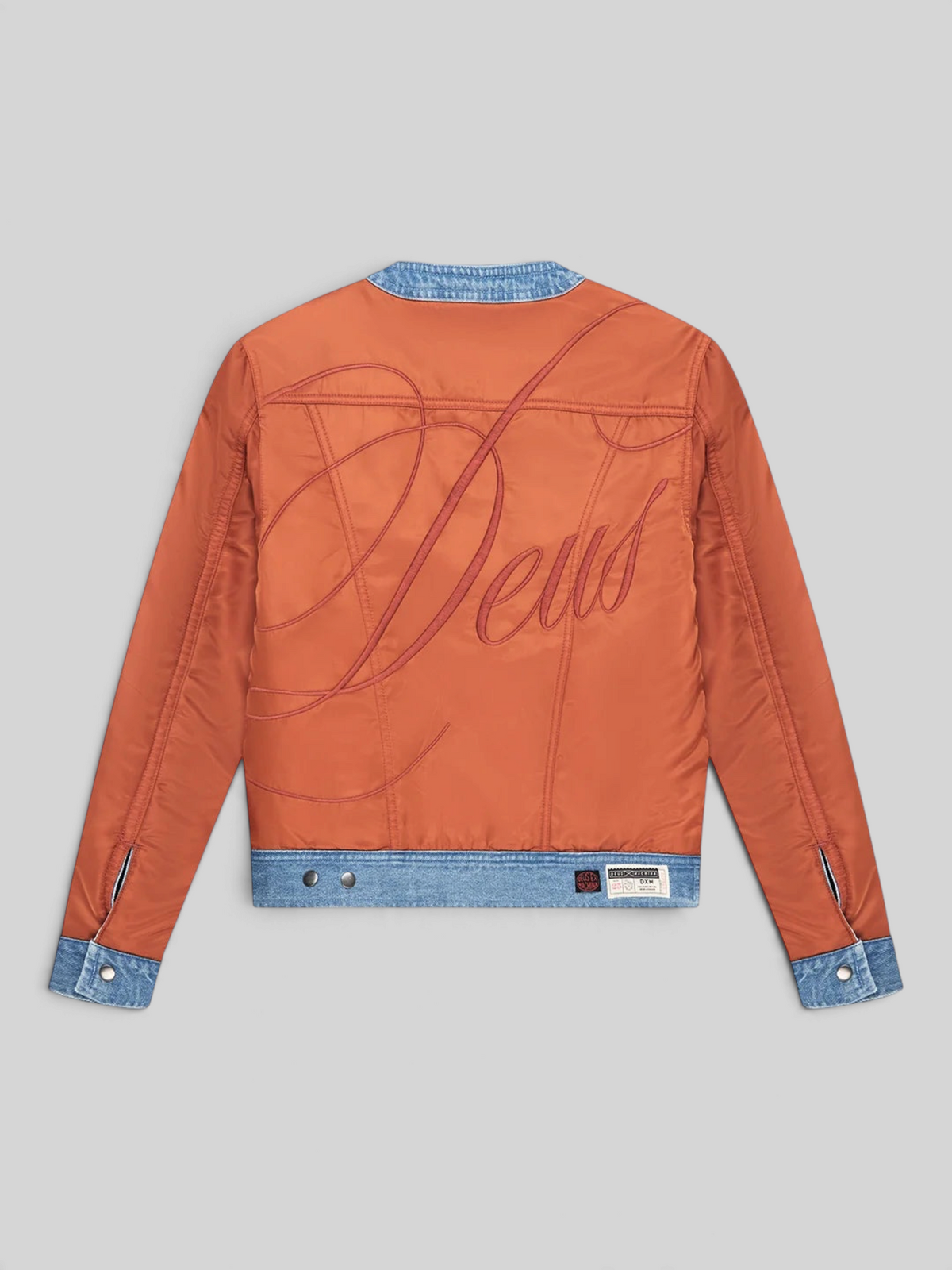 Baffle Haus Br 163 reversible jacket in rust nylon with large Deus embroidery and denim trim back view