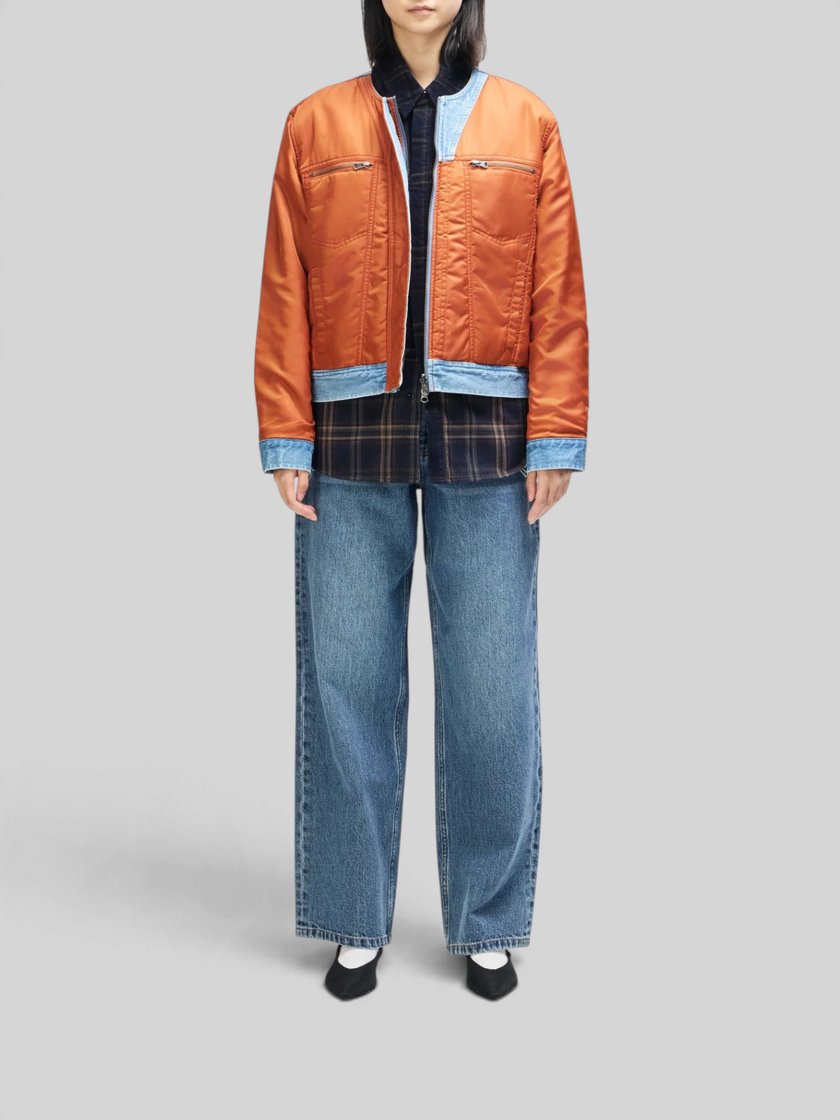 Baffle Haus Br 163 reversible jacket in rust nylon and indigo denim worn over a plaid shirt and wide-leg jeans