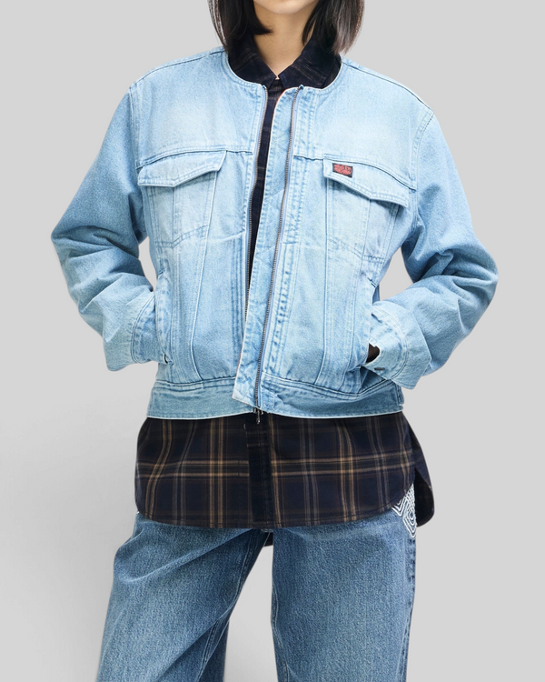 Baffle Haus Br 163 reversible light wash denim jacket with double zip closure worn over a plaid shirt