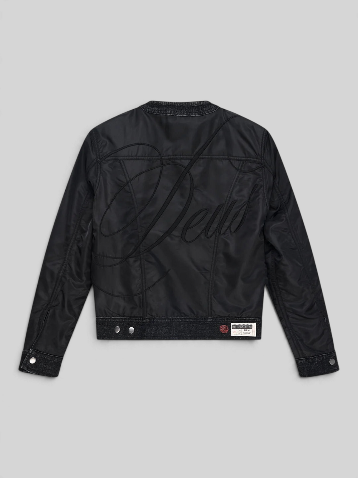 Baffle Haus Br 163 reversible black nylon jacket featuring large Deus embroidery on the back and utility label detail
