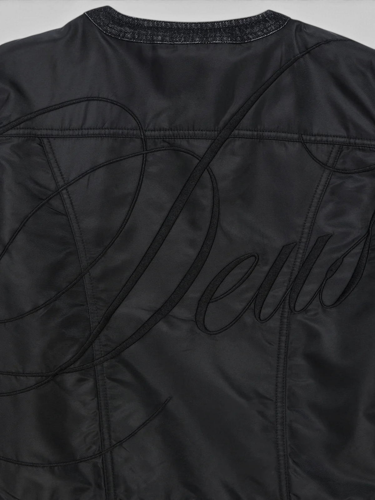 Baffle Haus Br 163 reversible jacket in phantom-black nylon with large tonal Deus embroidery on the back panel