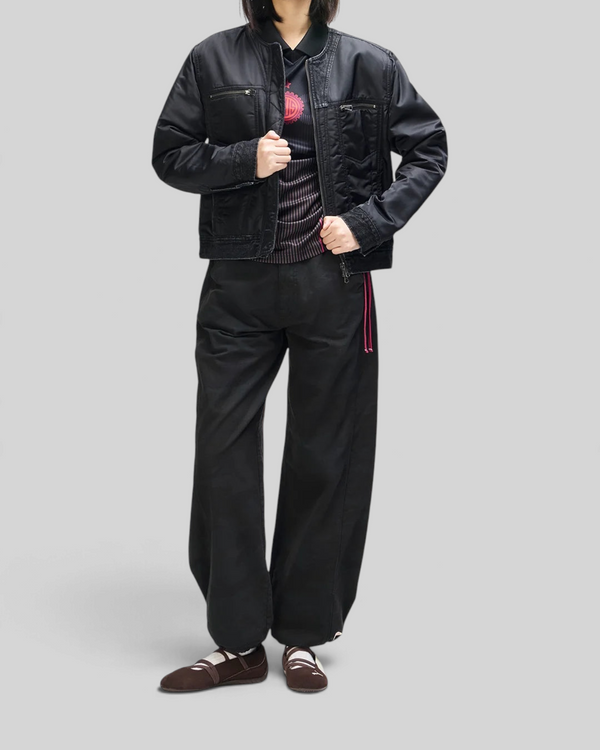 Baffle Haus Br 163 reversible black nylon and denim jacket worn by a model with matching black trousers