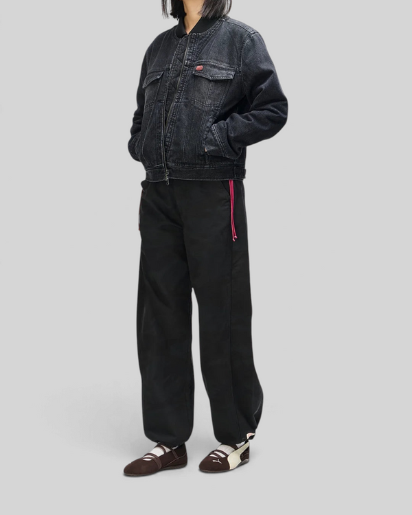 Baffle Haus Br 163 reversible phantom-black denim jacket worn by a model with black trousers and flat shoes.