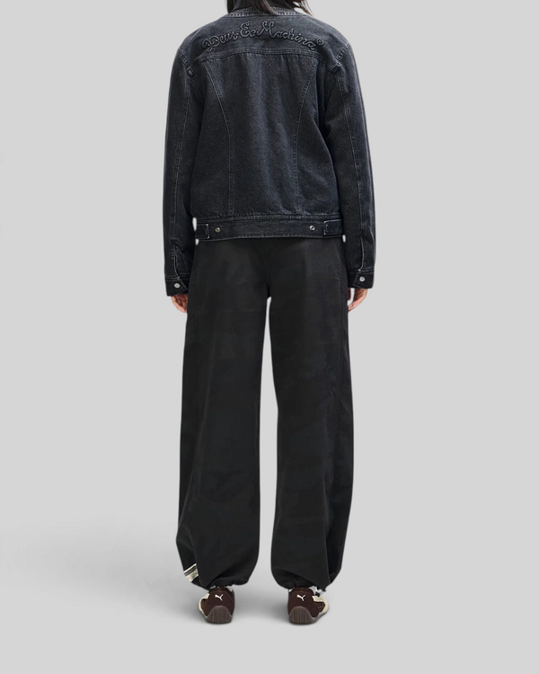 Baffle Haus Br 163 reversible black denim jacket featuring Deus Ex Machina embroidery on the back yoke, rear view.