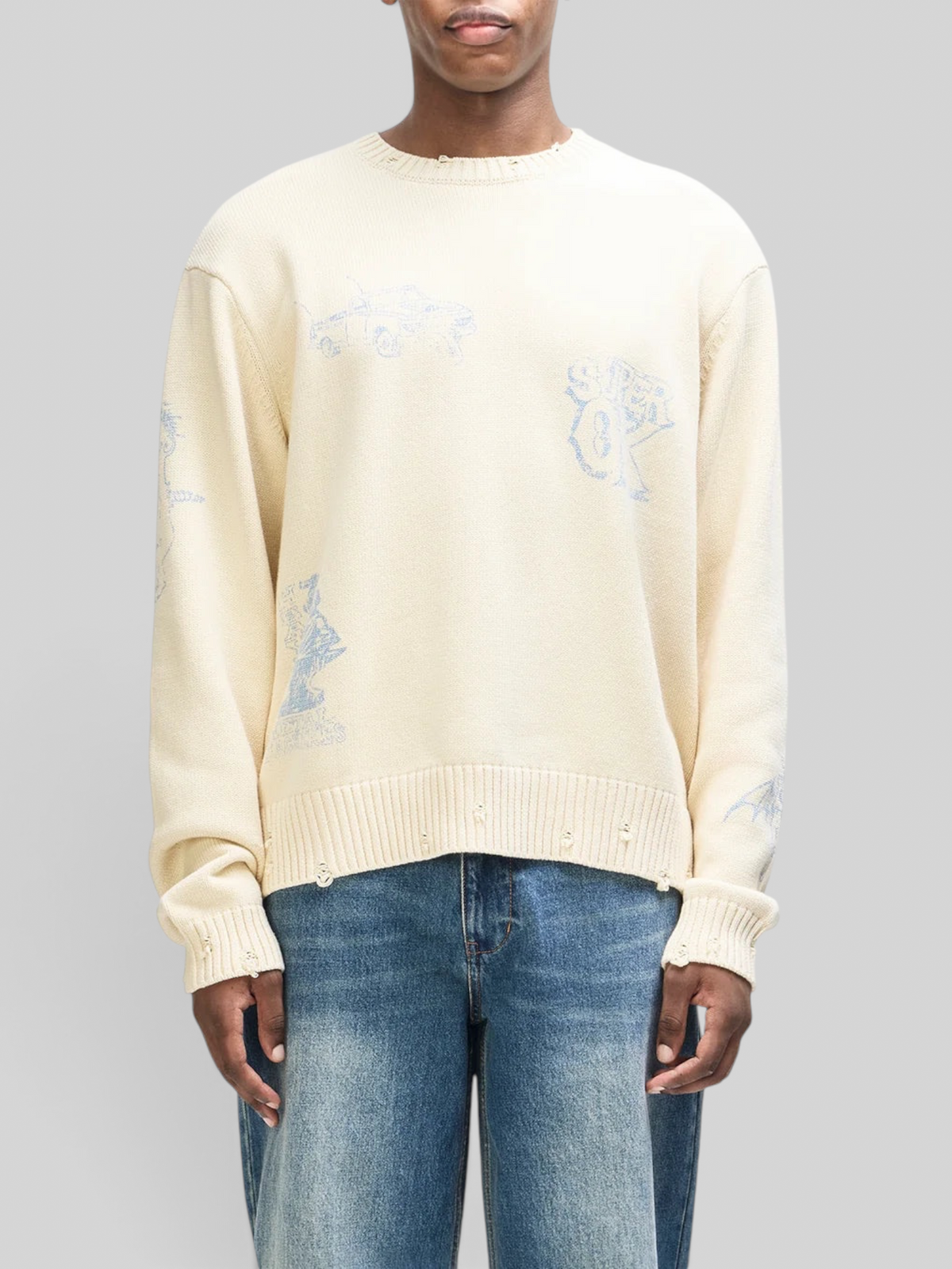 Baffle Haus cream cotton knit crew sweater with chambray blue hand-drawn graphics and distressed neck and hem detail