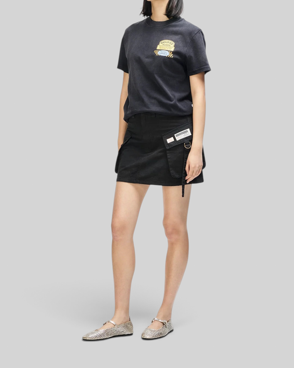 Baffle Haus Daphne Tee in anthracite grey cotton with chest pocket print worn with a black utility mini skirt