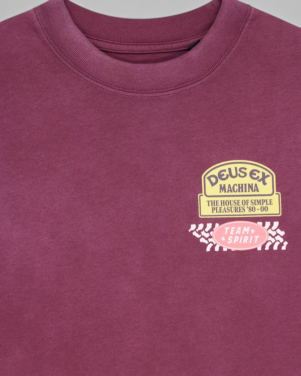 Baffle Haus Daphne Tee in burgundy pigment-dyed cotton with a vintage-style Deus Ex Machina chest pocket print