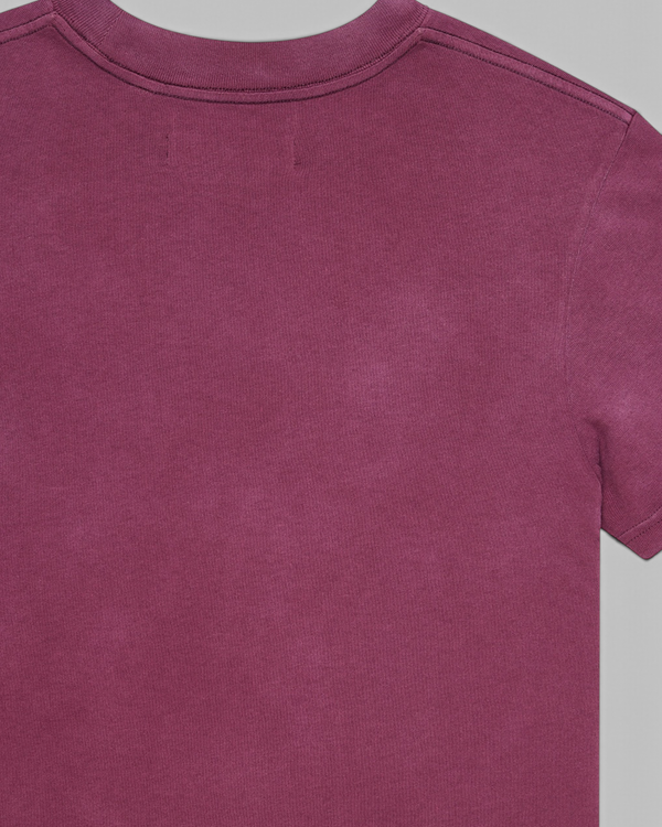 Baffle Haus Daphne Tee in pigment-dyed burgundy recycled cotton with a heavy enzyme wash and slim fit.