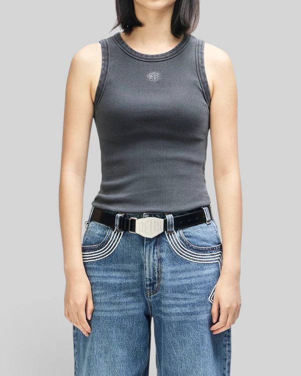 Baffle Haus anthracite grey ribbed cotton tank top with embroidered Deus shield logo on a model