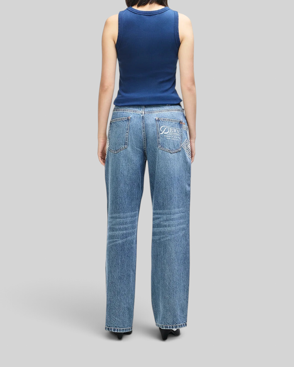 Baffle Haus pageant blue ribbed cotton tank top worn by a model from the back view