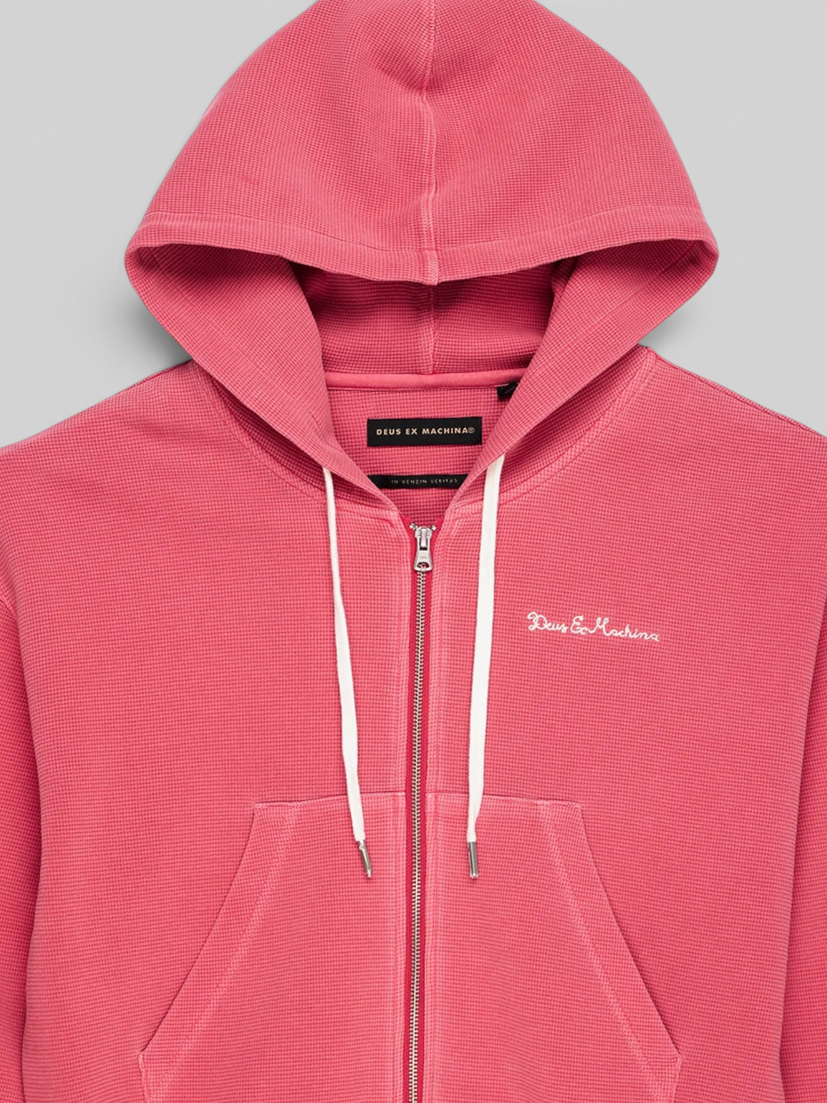 Baffle Haus Poinsettia Red waffle knit zip-up hoodie with white drawstring and Deus Ex Machina chest embroidery