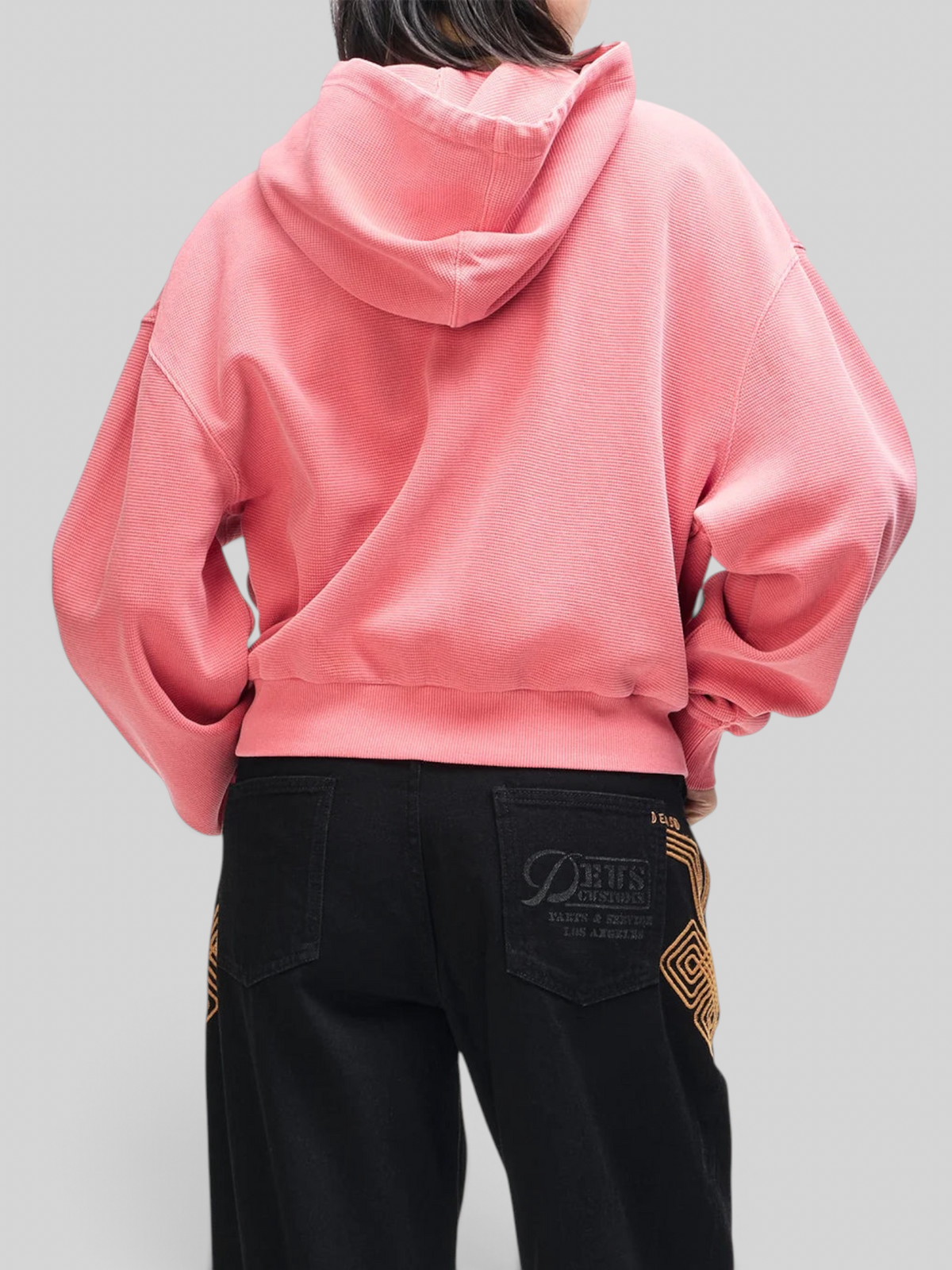 Baffle Haus poinsettia red relaxed fit waffle cotton zip hoodie worn from the back