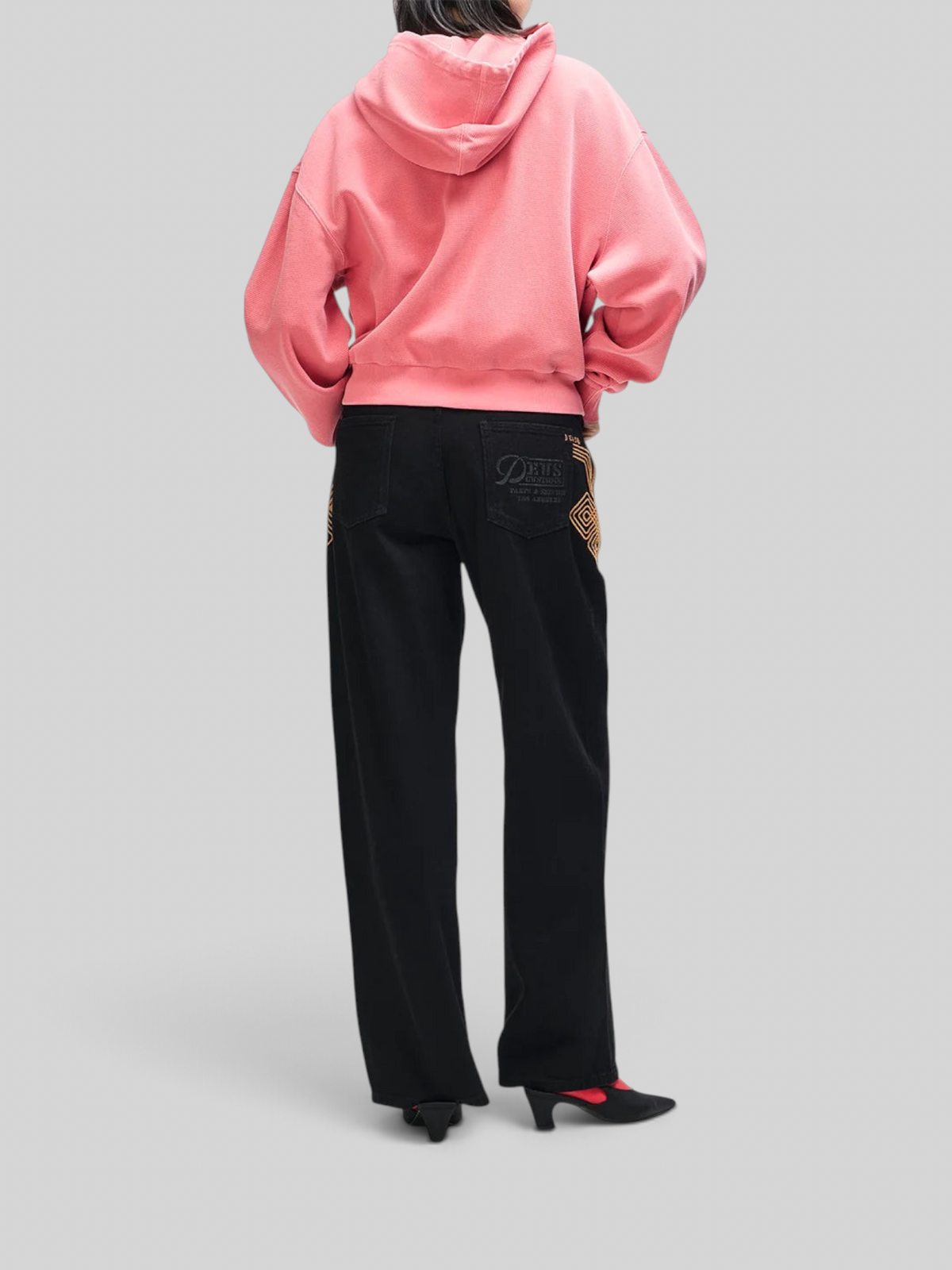 Baffle Haus relaxed fit Poinsettia Red waffle cotton zip hoodie worn by a model from the back view