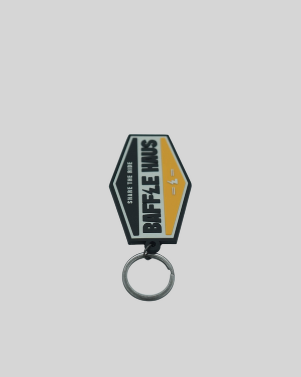 Baffle Haus yellow retro key tag made of durable embossed PVC with a debossed logo and metal split-ring.