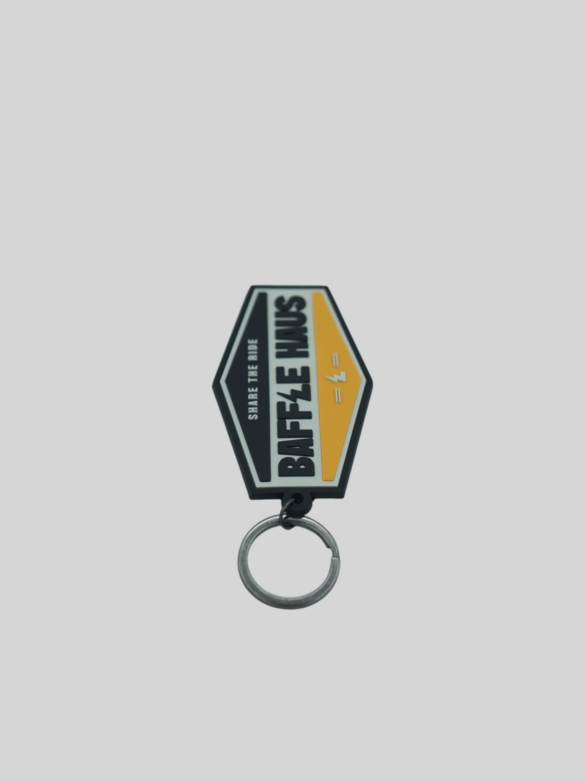 Baffle Haus yellow retro key tag made of durable embossed PVC with a debossed logo and metal split-ring.