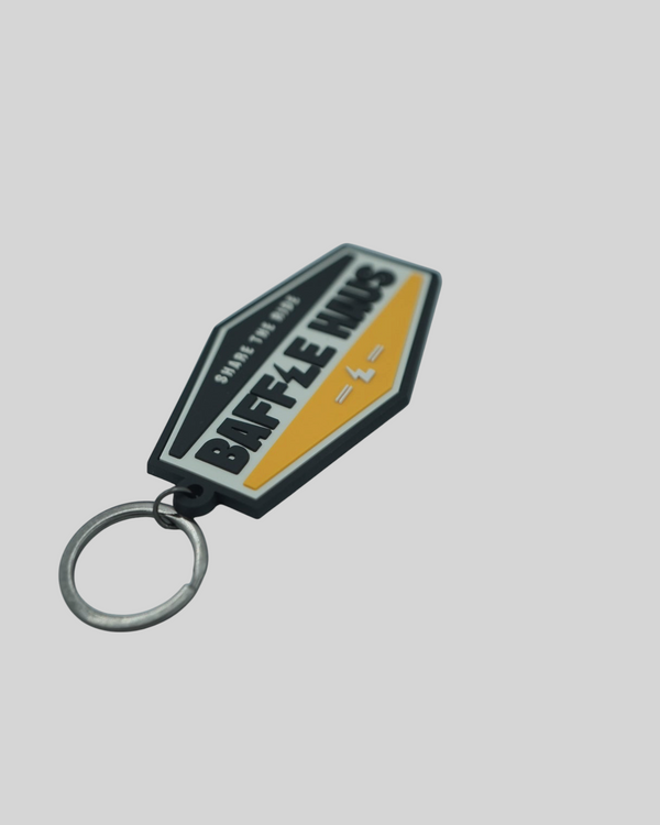 Baffle Haus yellow retro key tag made of durable embossed PVC with a debossed logo and metal split-ring keyring.