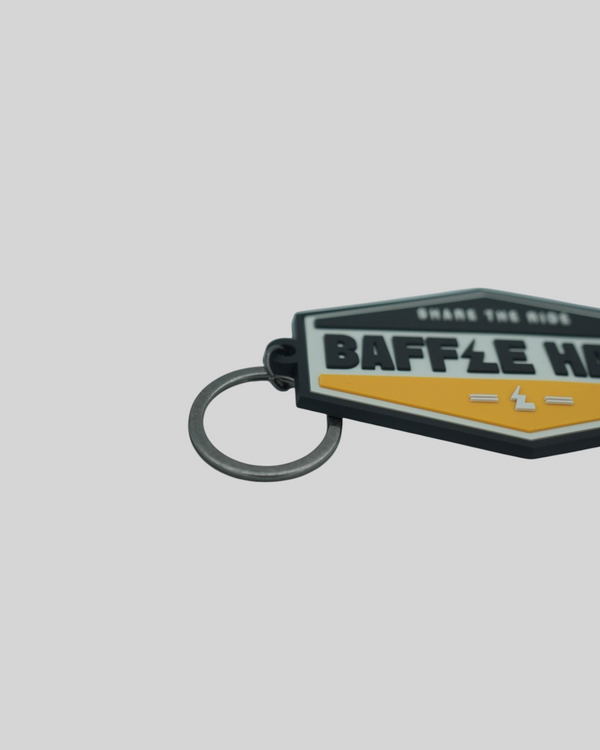 Baffle Haus yellow and black embossed PVC retro key tag with debossed logo and metal split-ring keyring