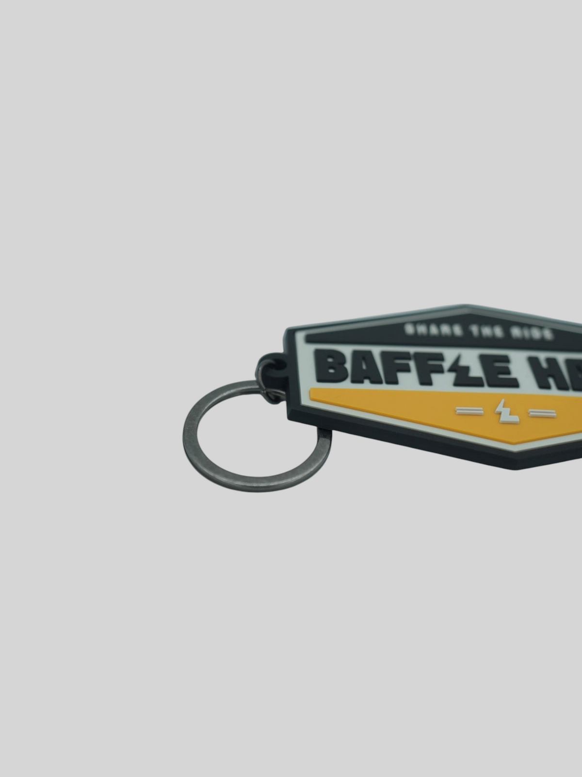 Baffle Haus yellow and black embossed PVC retro key tag with debossed logo and metal split-ring keyring