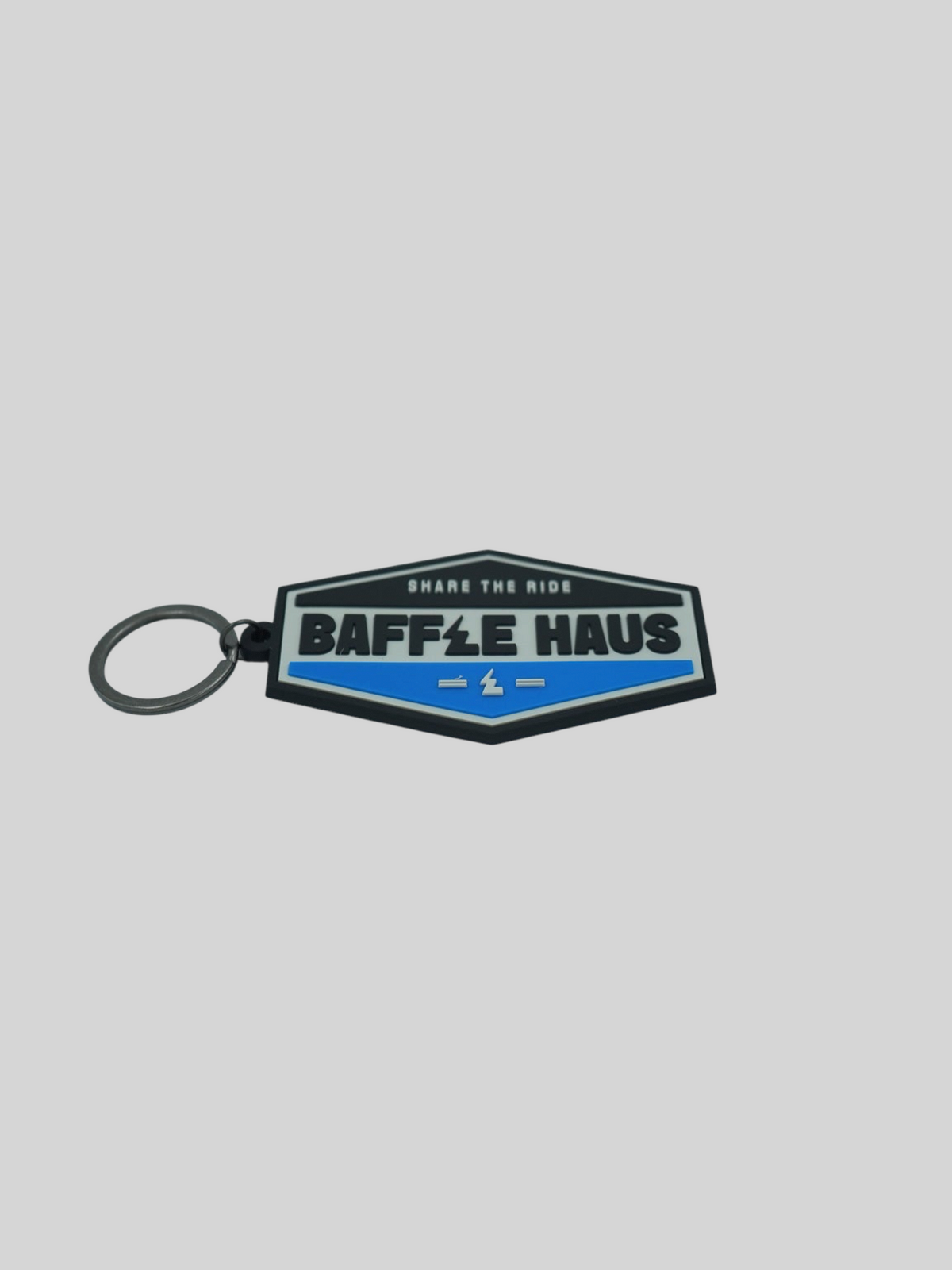 Baffle Haus blue retro key tag made of durable embossed PVC with a debossed logo and metal split-ring attachment.