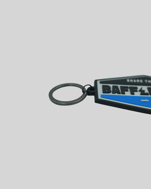 Baffle Haus blue and black embossed PVC retro key tag with a durable metal split-ring attachment.