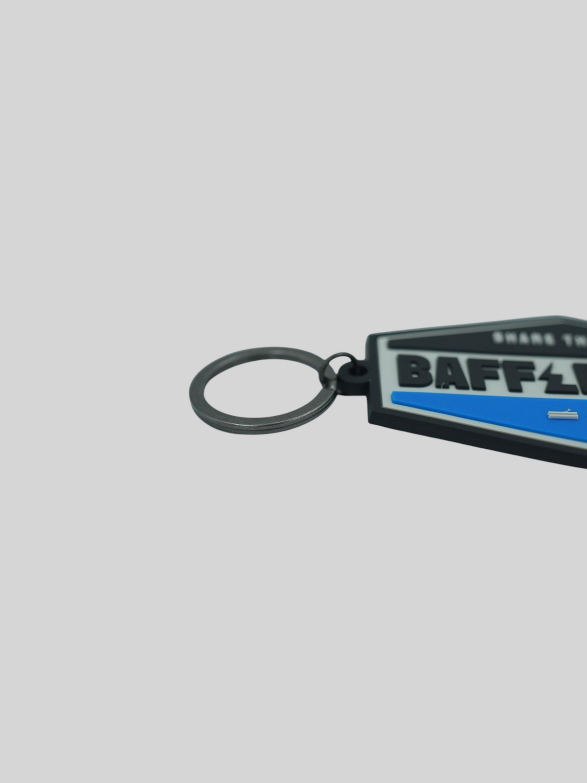 Baffle Haus blue and black embossed PVC retro key tag with a durable metal split-ring attachment.