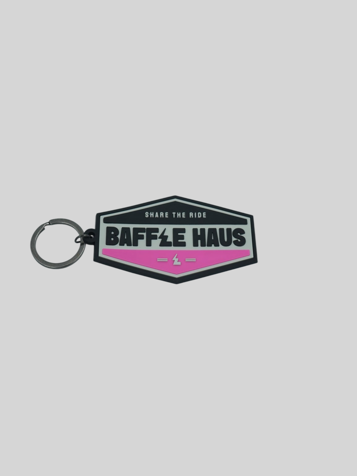 Baffle Haus retro key tag in pink and black embossed PVC with a durable split-ring keyring attachment.