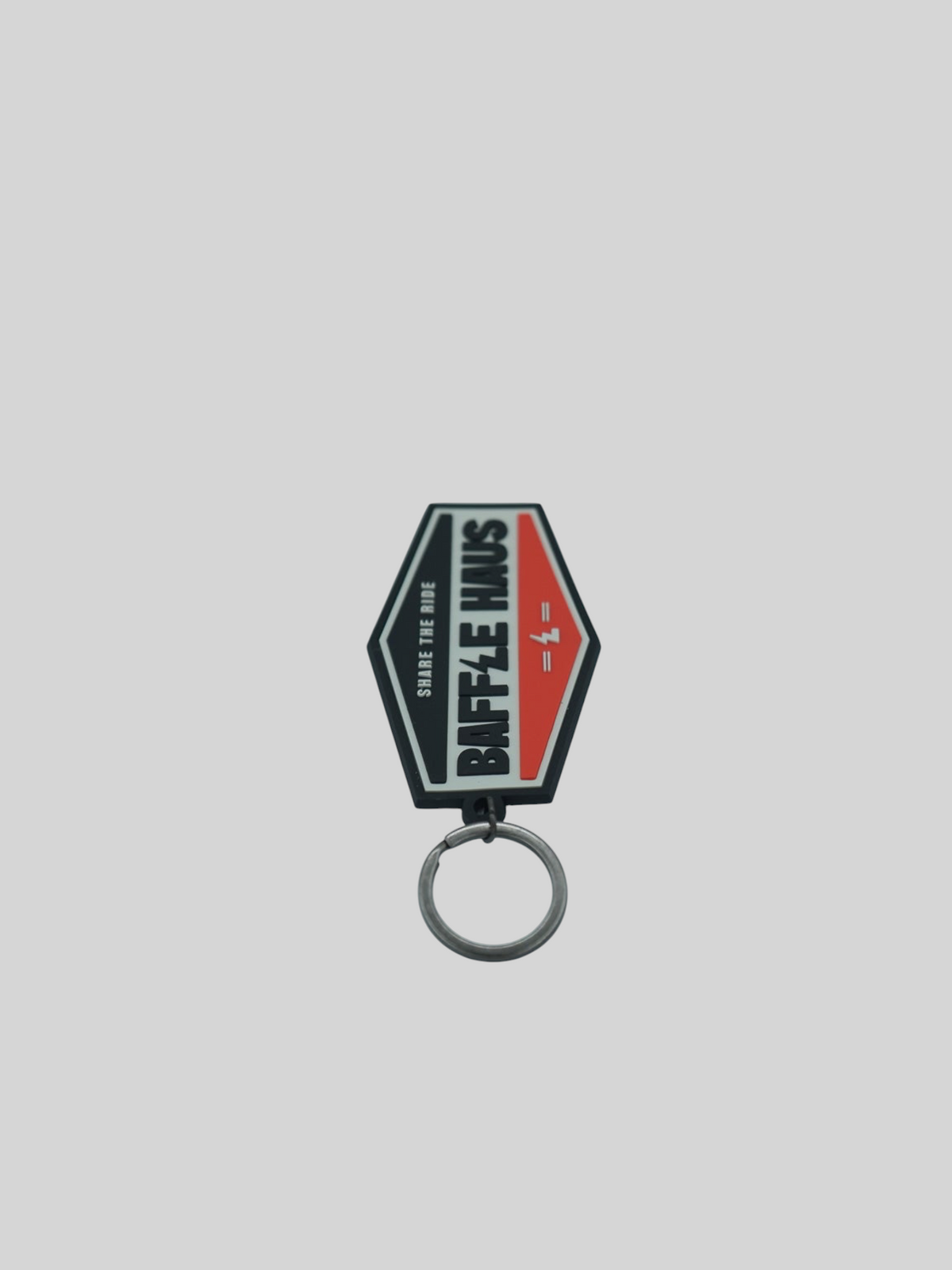 Baffle Haus orange retro key tag made of durable embossed PVC with a debossed logo and metal split-ring keyring.